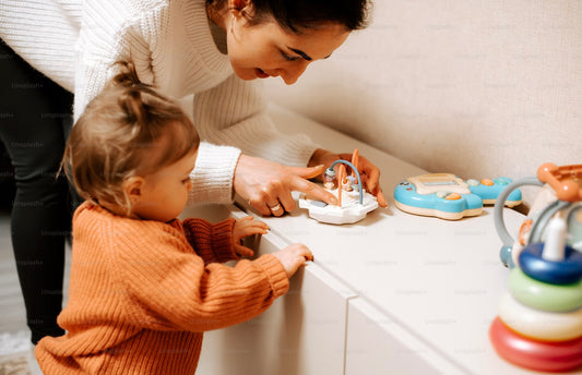 Picture of a new mother and a child playing with the best toys with kiddolab